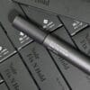 BL Lashes Noir Fix N Hold black tint enhancer tube displayed on top of multiple matching black product boxes.