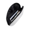 Open white zippered beauty pouch with black lining, containing professional lash and beauty tools including a brush, pen and boxed products.