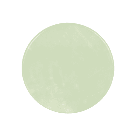Round pale green jade stone palette for holding eyelash extension adhesive during professional lash treatments.