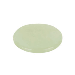 Pale green round jade stone palette for holding eyelash extension adhesive during professional lash treatments.