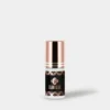 Glam Glue_5g_grey BL Lashes Glam Glue eyelash extension adhesive in a 5 g black bottle with a rose-gold cap on a light grey background.