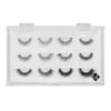 Lash Design Box_5 Clear lash design display box holding 12 false eyelash samples in different lengths, densities and volume styles on a white background.