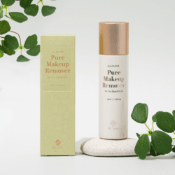 Pure Makeup Remover 2 BL Lashes All-in-One Pure Makeup Remover bottle with matching packaging, displayed on a light stone surface with green leaves.