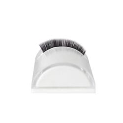 Transparent half-moon lash holder with a curved surface displaying a strip of black eyelash extensions.